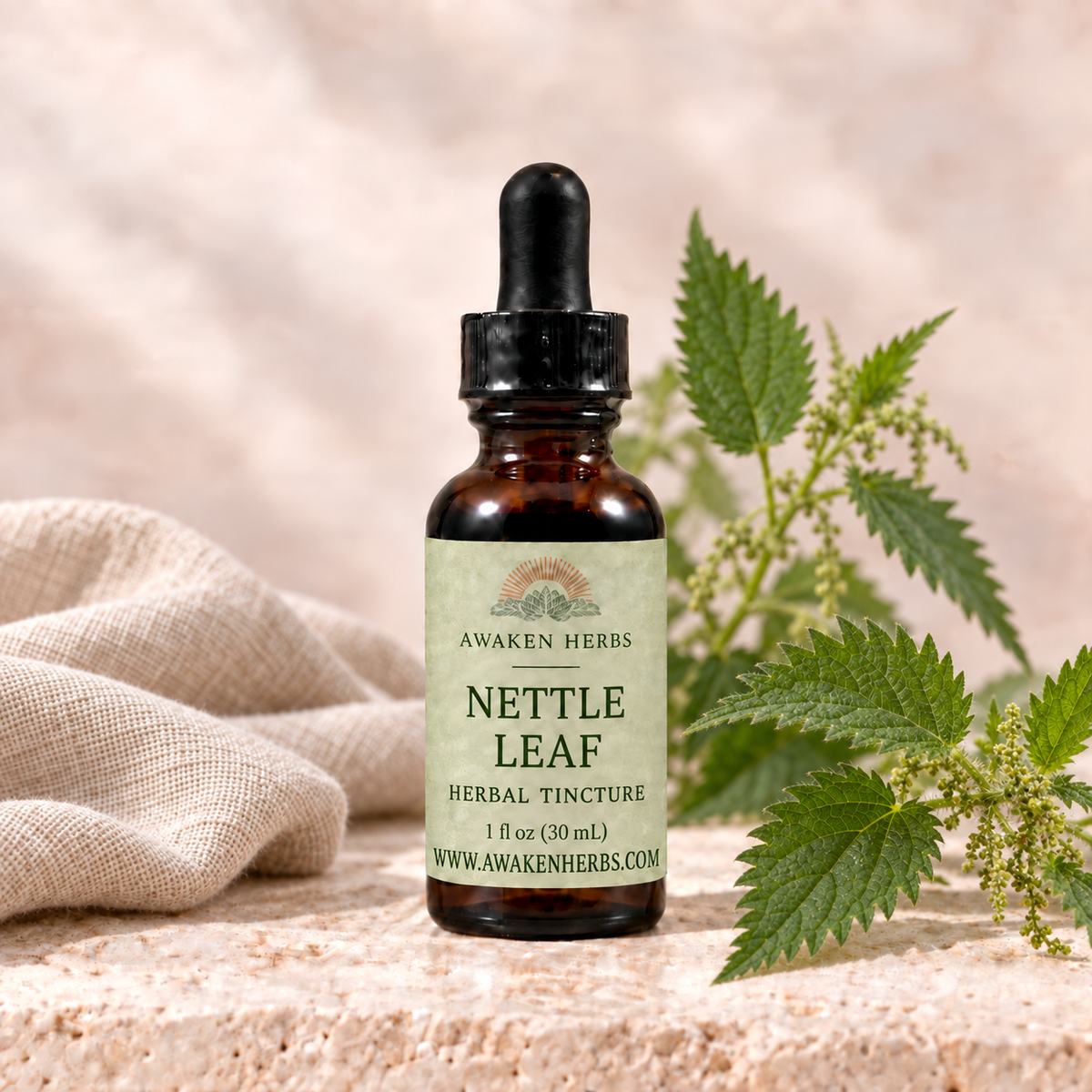 Awaken Herbs Nettle Leaf Tincture, 1 fl oz bottle with nettle leaves